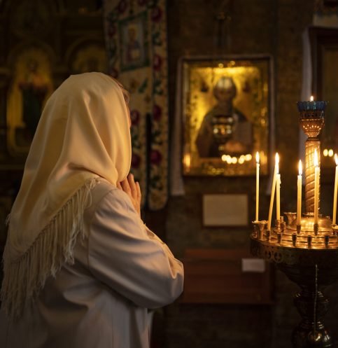 people-lighting-candles-church-celebration-greek-easter